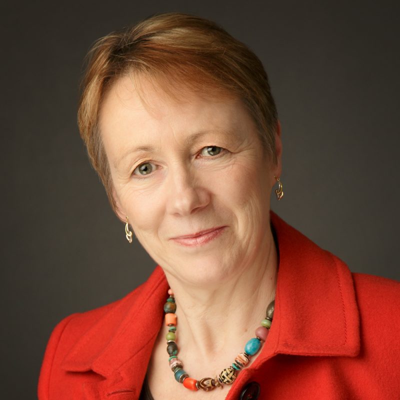Mature female in colour on dark grey background