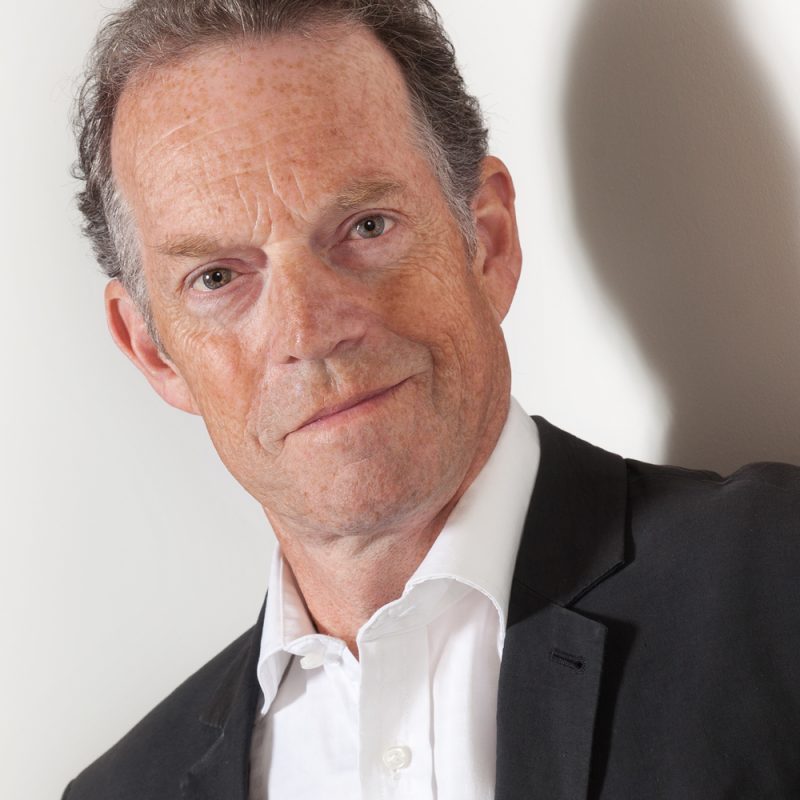 Casual business headshot male on light grey background