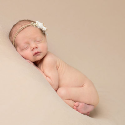 newborn lay on front