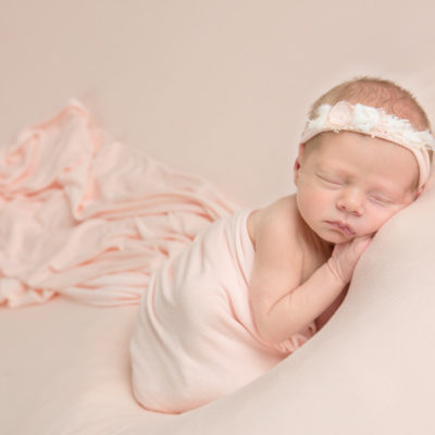 newborn with tieback and wrap