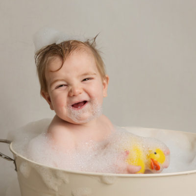 Baby laughing in bathtub