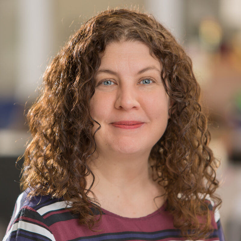 Female headshot in office environment