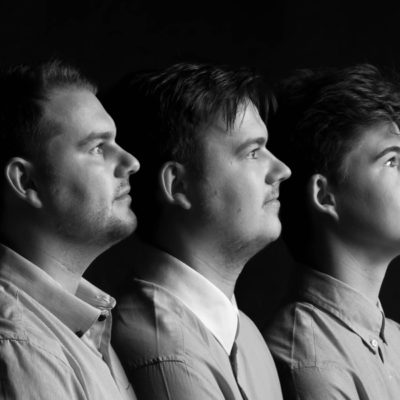 Three male siblings profile head shot