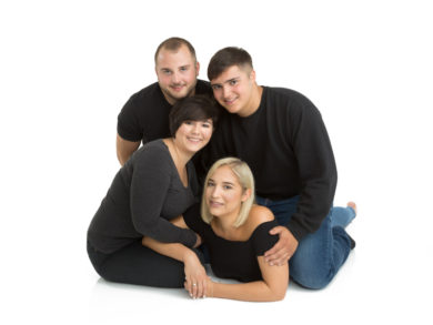 Male and female siblings in a group huddle
