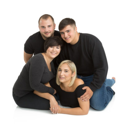 Male and female siblings in a group huddle