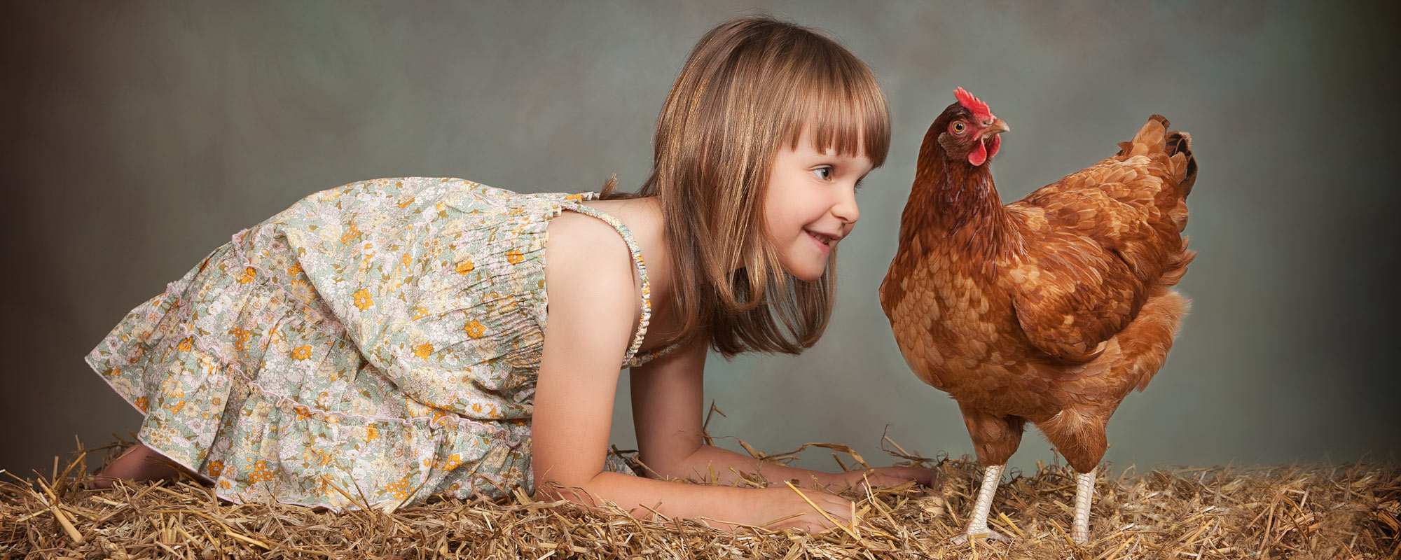 child with pet chicken