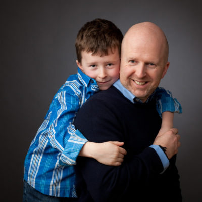 Dad with young son on his back