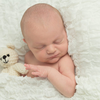 Newborn baby boy with teddy